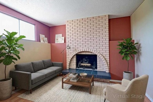 6307 Thornaby Way Nw, Calgary, AB - Indoor Photo Showing Living Room With Fireplace