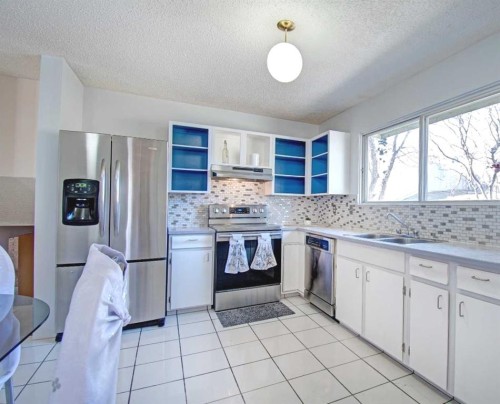 6307 Thornaby Way Nw, Calgary, AB - Indoor Photo Showing Kitchen With Stainless Steel Kitchen With Double Sink