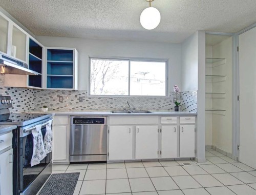 6307 Thornaby Way Nw, Calgary, AB - Indoor Photo Showing Kitchen With Double Sink