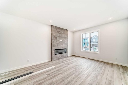48 Monarch Bend, Rural Rocky View County, AB - Indoor With Fireplace