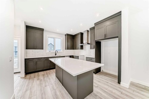 48 Monarch Bend, Rural Rocky View County, AB - Indoor Photo Showing Kitchen With Upgraded Kitchen