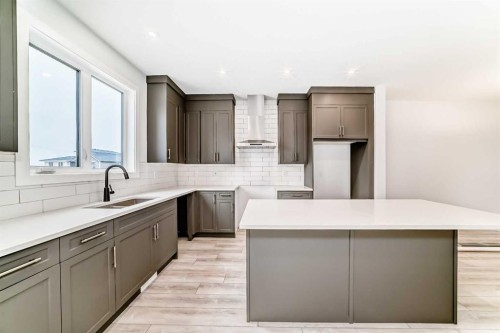 48 Monarch Bend, Rural Rocky View County, AB - Indoor Photo Showing Kitchen With Double Sink With Upgraded Kitchen