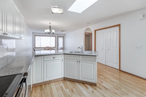 108 Quigley Close, Cochrane, AB - Indoor Photo Showing Kitchen With Double Sink