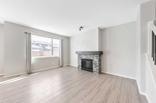 98 Lucas Crescent Nw, Calgary, AB - Indoor Photo Showing Living Room With Fireplace