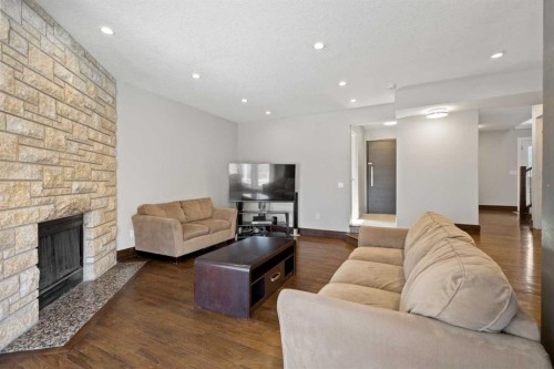40 Wood Crescent Sw, Calgary, AB - Indoor Photo Showing Living Room With Fireplace