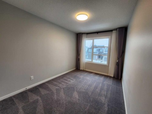 90 Howse Common Ne, Calgary, AB - Indoor Photo Showing Other Room