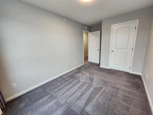 90 Howse Common Ne, Calgary, AB - Indoor Photo Showing Other Room