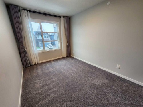 90 Howse Common Ne, Calgary, AB - Indoor Photo Showing Other Room