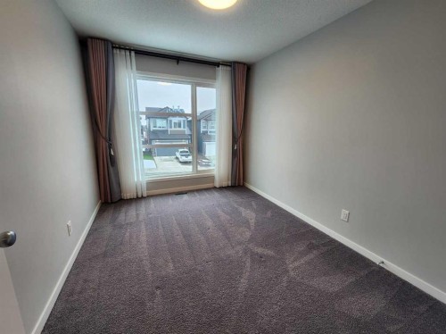 90 Howse Common Ne, Calgary, AB - Indoor Photo Showing Other Room
