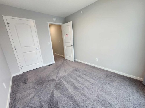 90 Howse Common Ne, Calgary, AB - Indoor Photo Showing Other Room
