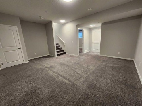 90 Howse Common Ne, Calgary, AB - Indoor Photo Showing Other Room