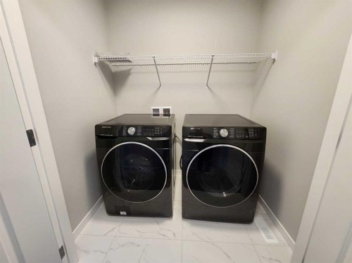 90 Howse Common Ne, Calgary, AB - Indoor Photo Showing Laundry Room