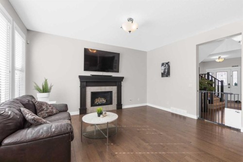 282 Mountainview Drive, Okotoks, AB - Indoor Photo Showing Living Room With Fireplace