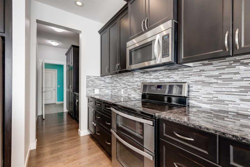 282 Mountainview Drive, Okotoks, AB - Indoor Photo Showing Kitchen With Upgraded Kitchen