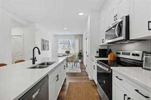 115 Legacy Passage Se, Calgary, AB - Indoor Photo Showing Kitchen With Double Sink With Upgraded Kitchen