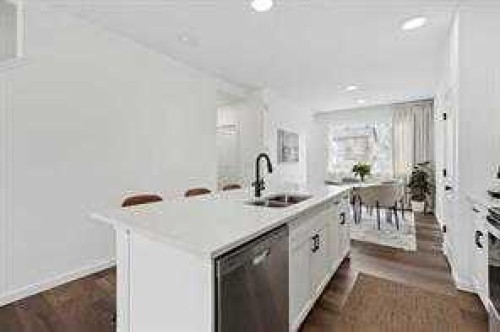 115 Legacy Passage Se, Calgary, AB - Indoor Photo Showing Kitchen With Double Sink With Upgraded Kitchen