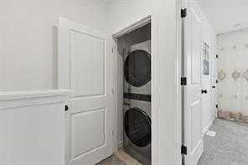 115 Legacy Passage Se, Calgary, AB - Indoor Photo Showing Laundry Room