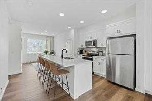 115 Legacy Passage Se, Calgary, AB - Indoor Photo Showing Kitchen With Stainless Steel Kitchen With Upgraded Kitchen