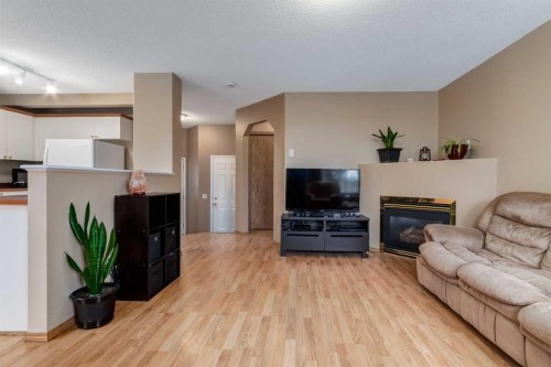 168 Mt Apex Green Se, Calgary, AB - Indoor Photo Showing Living Room With Fireplace