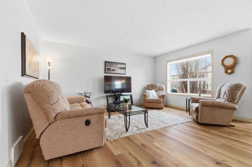329 Douglas Ridge Circle Se, Calgary, AB - Indoor Photo Showing Living Room