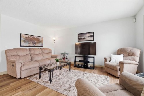 329 Douglas Ridge Circle Se, Calgary, AB - Indoor Photo Showing Living Room