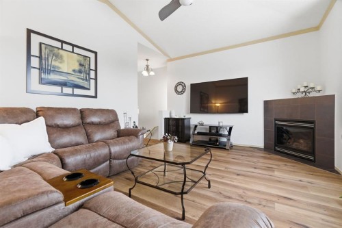 329 Douglas Ridge Circle Se, Calgary, AB - Indoor Photo Showing Living Room With Fireplace
