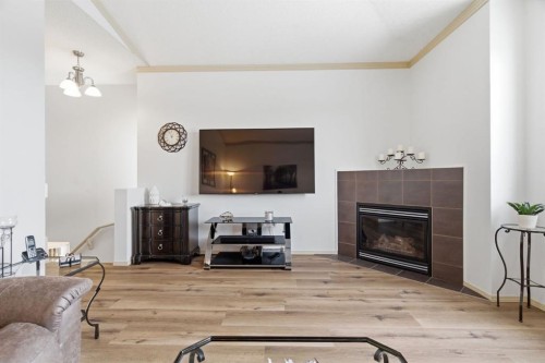 329 Douglas Ridge Circle Se, Calgary, AB - Indoor Photo Showing Living Room With Fireplace