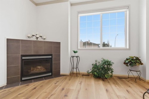 329 Douglas Ridge Circle Se, Calgary, AB - Indoor Photo Showing Living Room With Fireplace