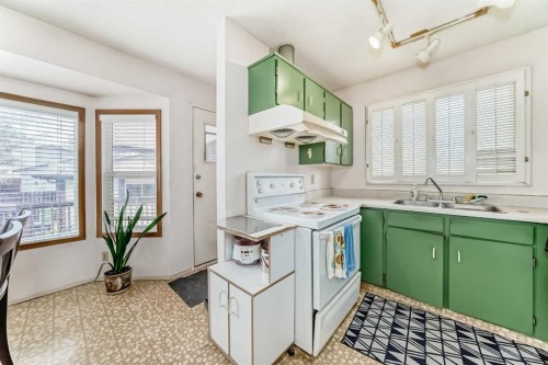 224 Berwick Way Nw, Calgary, AB - Indoor Photo Showing Kitchen With Double Sink