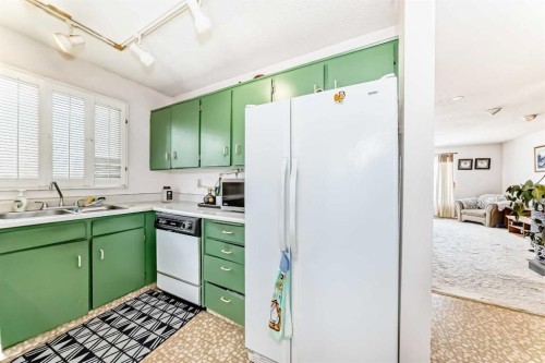 224 Berwick Way Nw, Calgary, AB - Indoor Photo Showing Kitchen With Double Sink