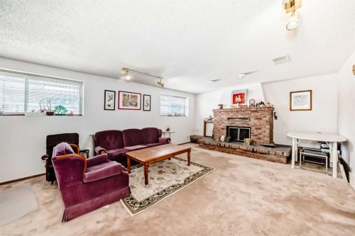 224 Berwick Way Nw, Calgary, AB - Indoor Photo Showing Living Room With Fireplace