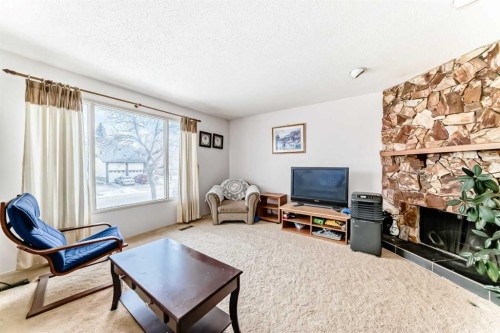 224 Berwick Way Nw, Calgary, AB - Indoor Photo Showing Living Room With Fireplace
