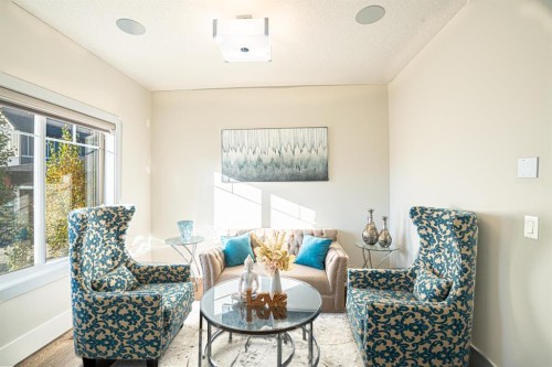 321 Kinniburgh Cove, Chestermere, AB - Indoor Photo Showing Living Room