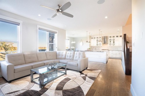 321 Kinniburgh Cove, Chestermere, AB - Indoor Photo Showing Living Room