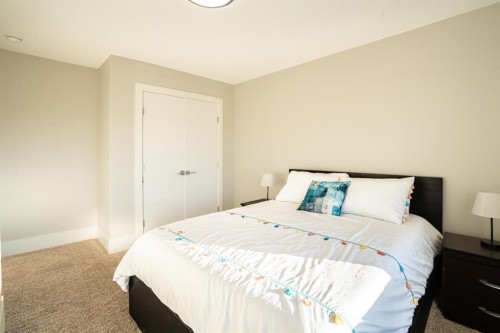 321 Kinniburgh Cove, Chestermere, AB - Indoor Photo Showing Bedroom