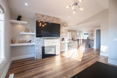 321 Kinniburgh Cove, Chestermere, AB - Indoor With Fireplace