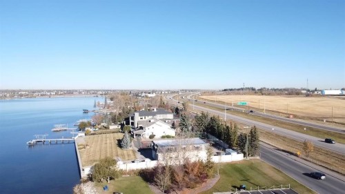 321 Kinniburgh Cove, Chestermere, AB - Outdoor With Body Of Water With View