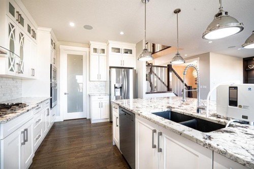 321 Kinniburgh Cove, Chestermere, AB - Indoor Photo Showing Kitchen With Double Sink With Upgraded Kitchen