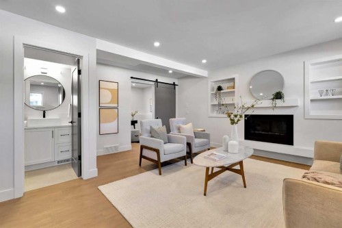 928 Lake Twintree Crescent Se, Calgary, AB - Indoor Photo Showing Living Room With Fireplace
