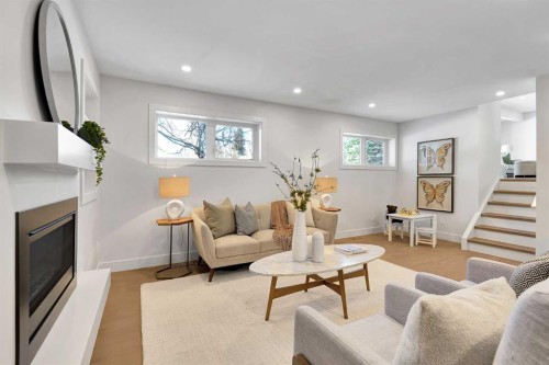 928 Lake Twintree Crescent Se, Calgary, AB - Indoor Photo Showing Living Room With Fireplace