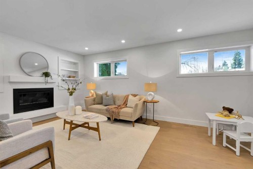 928 Lake Twintree Crescent Se, Calgary, AB - Indoor Photo Showing Living Room With Fireplace