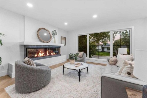 10404 Maplemont Road Se, Calgary, AB - Indoor Photo Showing Living Room With Fireplace