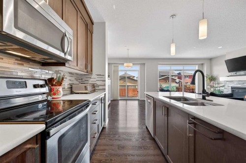 15 Fireside Crescent, Cochrane, AB - Indoor Photo Showing Kitchen With Double Sink With Upgraded Kitchen