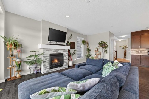 15 Fireside Crescent, Cochrane, AB - Indoor Photo Showing Living Room With Fireplace