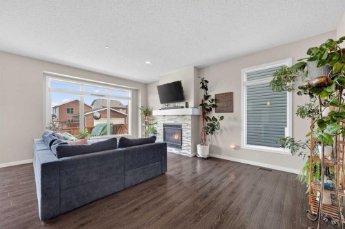 15 Fireside Crescent, Cochrane, AB - Indoor Photo Showing Living Room With Fireplace