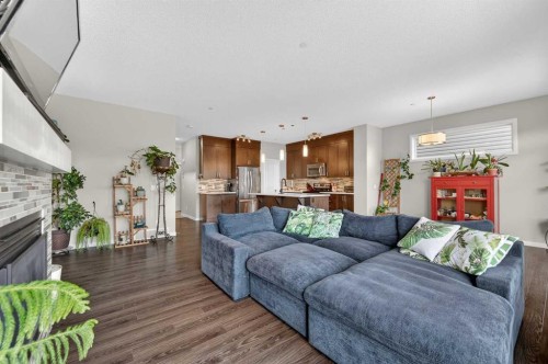 15 Fireside Crescent, Cochrane, AB - Indoor Photo Showing Living Room With Fireplace