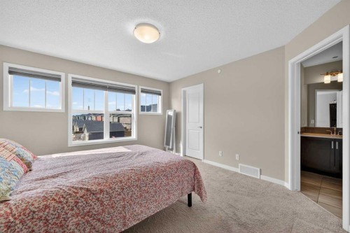 15 Fireside Crescent, Cochrane, AB - Indoor Photo Showing Bedroom
