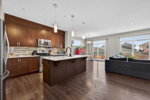 15 Fireside Crescent, Cochrane, AB - Indoor Photo Showing Kitchen With Upgraded Kitchen