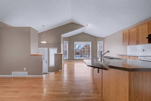 522 Evermeadow Road Sw, Calgary, AB - Indoor Photo Showing Kitchen With Double Sink