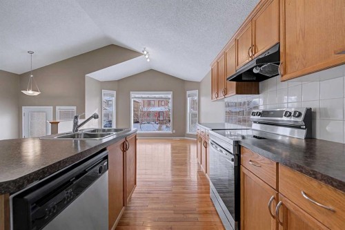 522 Evermeadow Road Sw, Calgary, AB - Indoor Photo Showing Kitchen With Double Sink